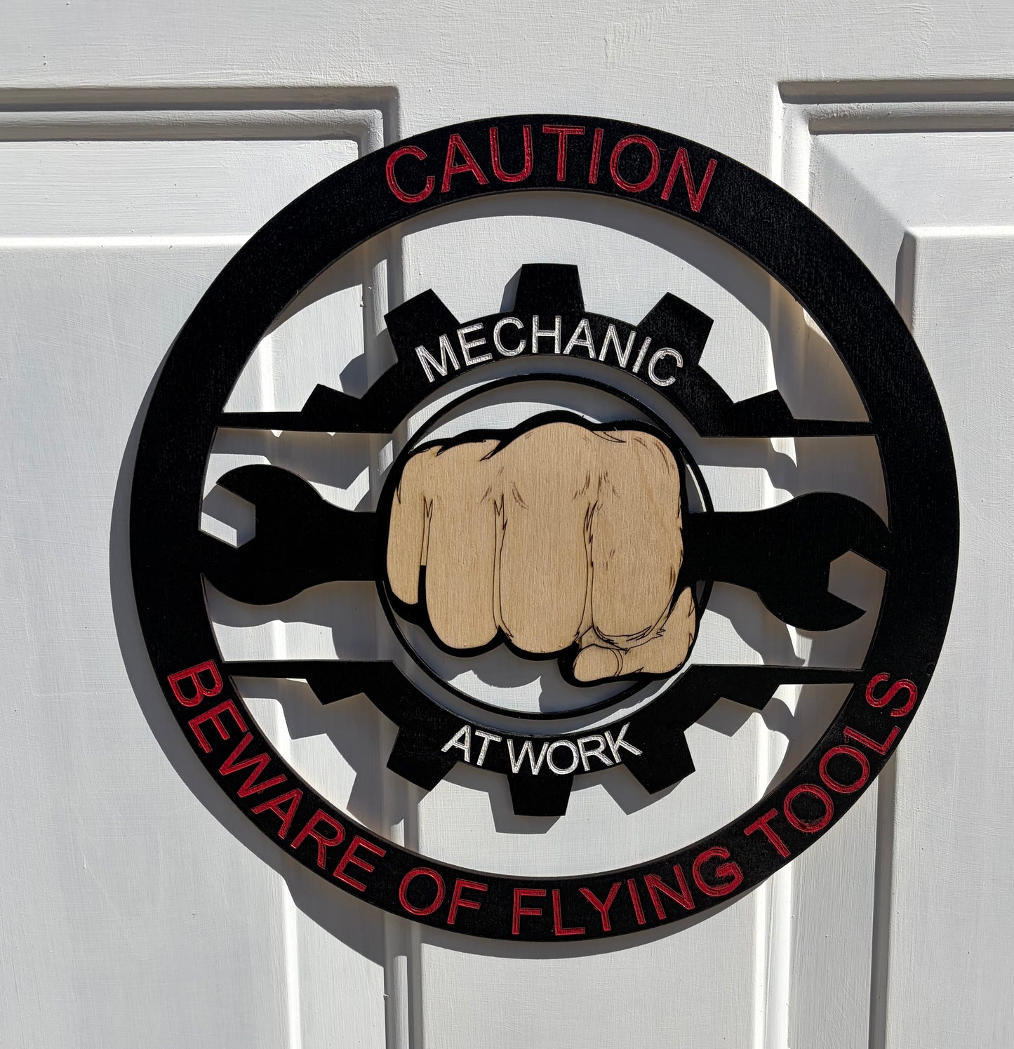 CAUTION MECHANIC AT WORK BEWARE OF FLYING TOOLS