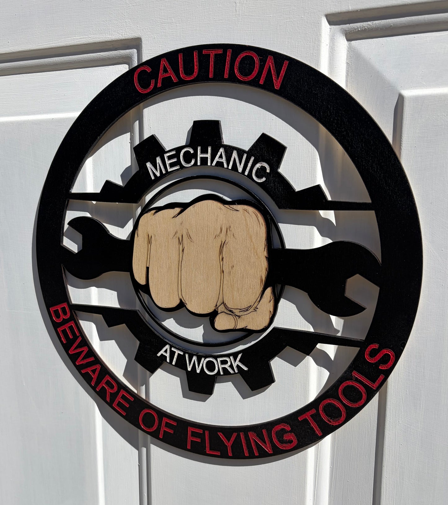 CAUTION MECHANIC AT WORK BEWARE OF FLYING TOOLS